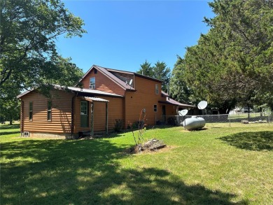 RUSTIC 1 1/2 STORY HOME NESTLED ON 3.11 ACRES IN A PARK LIKE on Pineridge Golf Course in Missouri - for sale on GolfHomes.com, golf home, golf lot