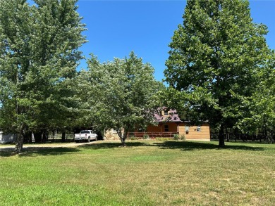 RUSTIC 1 1/2 STORY HOME NESTLED ON 3.11 ACRES IN A PARK LIKE on Pineridge Golf Course in Missouri - for sale on GolfHomes.com, golf home, golf lot