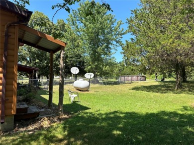 RUSTIC 1 1/2 STORY HOME NESTLED ON 3.11 ACRES IN A PARK LIKE on Pineridge Golf Course in Missouri - for sale on GolfHomes.com, golf home, golf lot