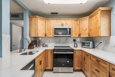 REDUCED PRICE!! GOLF COURSE AND WATER VIEWS! Updated on The American Golf Club in Florida - for sale on GolfHomes.com, golf home, golf lot