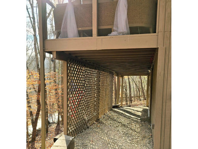 Escape to your serene retreat in the woods. Nestled above Lake on Hide-A-Way Hills Golf Club in Ohio - for sale on GolfHomes.com, golf home, golf lot