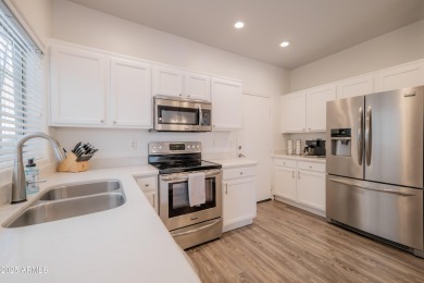 Discover this stunning townhome in the highly sought-after on Palm Valley Golf Club  in Arizona - for sale on GolfHomes.com, golf home, golf lot