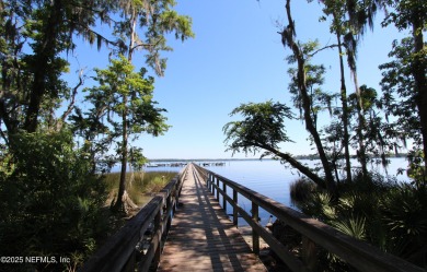 Welcome to Paradise! Enjoy the sound of birds and the beautiful on Eagle Harbor Golf Club in Florida - for sale on GolfHomes.com, golf home, golf lot