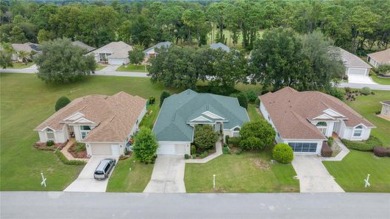 This home has everything you desire!! Prime location in a gated on Royal Oaks Golf Club in Florida - for sale on GolfHomes.com, golf home, golf lot