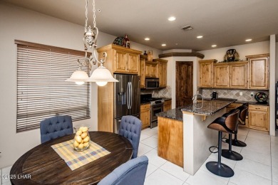 Take a look at this stunning RV garage home located in a private on London Bridge Golf Course in Arizona - for sale on GolfHomes.com, golf home, golf lot