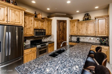 Take a look at this stunning RV garage home located in a private on London Bridge Golf Course in Arizona - for sale on GolfHomes.com, golf home, golf lot