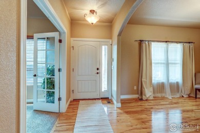 Beautiful custom built 5-bedroom, 4-bath two-story home tucked on Pelican Lakes Golf and Country Club in Colorado - for sale on GolfHomes.com, golf home, golf lot