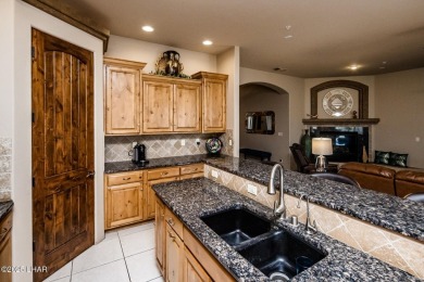 Take a look at this stunning RV garage home located in a private on London Bridge Golf Course in Arizona - for sale on GolfHomes.com, golf home, golf lot