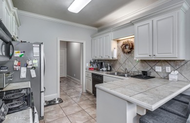 Welcome Home to this 3 bed, 2 bath home.  It offers an open on Lake Caroline Golf Club in Mississippi - for sale on GolfHomes.com, golf home, golf lot