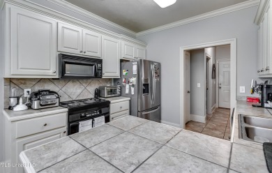 Welcome Home to this 3 bed, 2 bath home.  It offers an open on Lake Caroline Golf Club in Mississippi - for sale on GolfHomes.com, golf home, golf lot