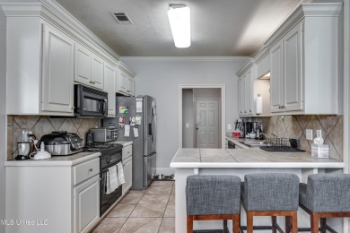 Welcome Home to this 3 bed, 2 bath home.  It offers an open on Lake Caroline Golf Club in Mississippi - for sale on GolfHomes.com, golf home, golf lot