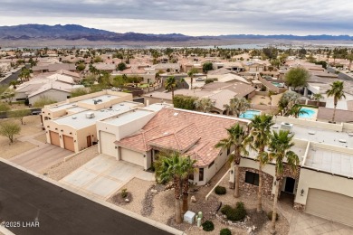 Take a look at this stunning RV garage home located in a private on London Bridge Golf Course in Arizona - for sale on GolfHomes.com, golf home, golf lot