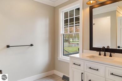 This brilliantly restored home delivers comfort, charm, and on Charlevoix Golf Club in Michigan - for sale on GolfHomes.com, golf home, golf lot
