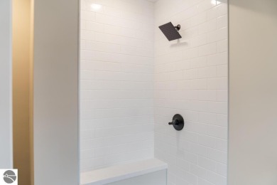 This brilliantly restored home delivers comfort, charm, and on Charlevoix Golf Club in Michigan - for sale on GolfHomes.com, golf home, golf lot