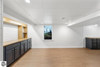 This brilliantly restored home delivers comfort, charm, and on Charlevoix Golf Club in Michigan - for sale on GolfHomes.com, golf home, golf lot