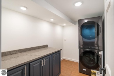 This brilliantly restored home delivers comfort, charm, and on Charlevoix Golf Club in Michigan - for sale on GolfHomes.com, golf home, golf lot