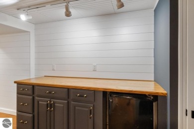 This brilliantly restored home delivers comfort, charm, and on Charlevoix Golf Club in Michigan - for sale on GolfHomes.com, golf home, golf lot