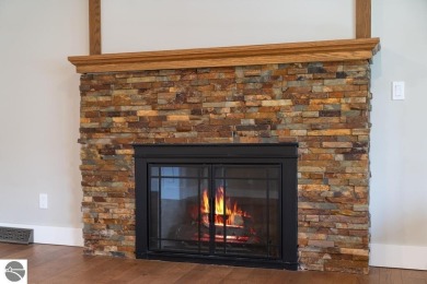 This brilliantly restored home delivers comfort, charm, and on Charlevoix Golf Club in Michigan - for sale on GolfHomes.com, golf home, golf lot