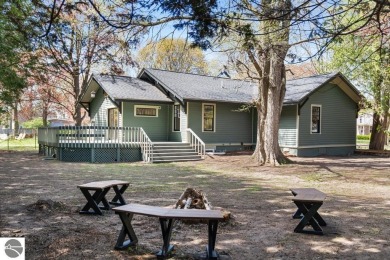 This brilliantly restored home delivers comfort, charm, and on Charlevoix Golf Club in Michigan - for sale on GolfHomes.com, golf home, golf lot