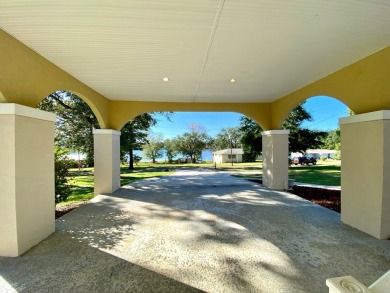 Elegant Arched views of Dogwood Lake presents both peace and on Dogwood Lakes Golf Club in Florida - for sale on GolfHomes.com, golf home, golf lot