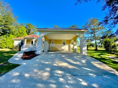 Elegant Arched views of Dogwood Lake presents both peace and on Dogwood Lakes Golf Club in Florida - for sale on GolfHomes.com, golf home, golf lot