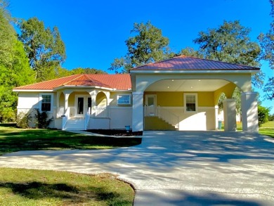 Elegant Arched views of Dogwood Lake presents both peace and on Dogwood Lakes Golf Club in Florida - for sale on GolfHomes.com, golf home, golf lot