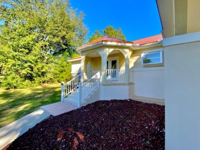 Elegant Arched views of Dogwood Lake presents both peace and on Dogwood Lakes Golf Club in Florida - for sale on GolfHomes.com, golf home, golf lot