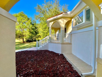 Elegant Arched views of Dogwood Lake presents both peace and on Dogwood Lakes Golf Club in Florida - for sale on GolfHomes.com, golf home, golf lot