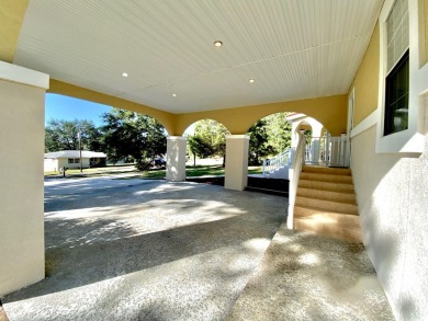 Elegant Arched views of Dogwood Lake presents both peace and on Dogwood Lakes Golf Club in Florida - for sale on GolfHomes.com, golf home, golf lot