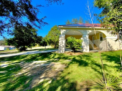 Elegant Arched views of Dogwood Lake presents both peace and on Dogwood Lakes Golf Club in Florida - for sale on GolfHomes.com, golf home, golf lot