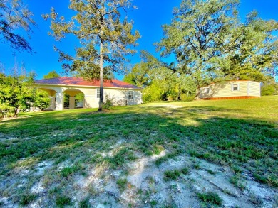 Elegant Arched views of Dogwood Lake presents both peace and on Dogwood Lakes Golf Club in Florida - for sale on GolfHomes.com, golf home, golf lot