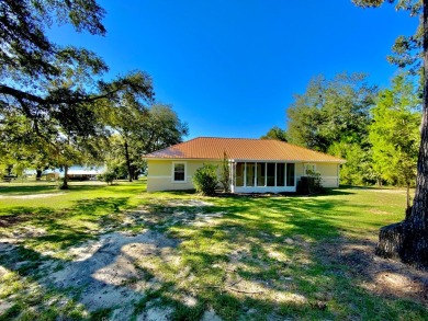 Elegant Arched views of Dogwood Lake presents both peace and on Dogwood Lakes Golf Club in Florida - for sale on GolfHomes.com, golf home, golf lot