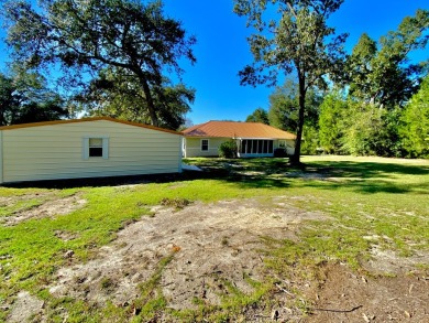 Elegant Arched views of Dogwood Lake presents both peace and on Dogwood Lakes Golf Club in Florida - for sale on GolfHomes.com, golf home, golf lot