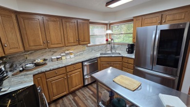 Discover your dream home in the heart of Fairfield Bay's resort on Mountain Ranch Golf Club in Arkansas - for sale on GolfHomes.com, golf home, golf lot