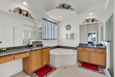 This beautiful home features 4 bedrooms and 3 bathrooms, plus a on Highlands Reserve Golf Club in Florida - for sale on GolfHomes.com, golf home, golf lot