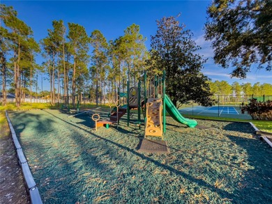 This beautiful home features 4 bedrooms and 3 bathrooms, plus a on Highlands Reserve Golf Club in Florida - for sale on GolfHomes.com, golf home, golf lot