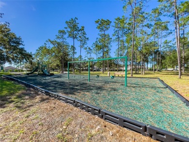 This beautiful home features 4 bedrooms and 3 bathrooms, plus a on Highlands Reserve Golf Club in Florida - for sale on GolfHomes.com, golf home, golf lot