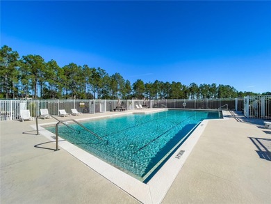This beautiful home features 4 bedrooms and 3 bathrooms, plus a on Highlands Reserve Golf Club in Florida - for sale on GolfHomes.com, golf home, golf lot