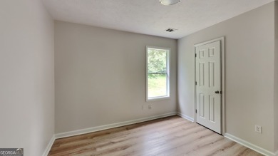 This renovated 3 bedroom, 2 bathroom home offers modern living on Mystery Valley Golf Course in Georgia - for sale on GolfHomes.com, golf home, golf lot