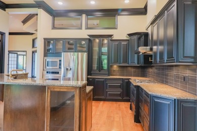 This stunning all-brick home, has been completely remodeled to on RidgePointe Country Club in Arkansas - for sale on GolfHomes.com, golf home, golf lot