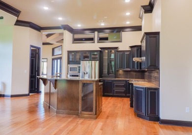 This stunning all-brick home, has been completely remodeled to on RidgePointe Country Club in Arkansas - for sale on GolfHomes.com, golf home, golf lot