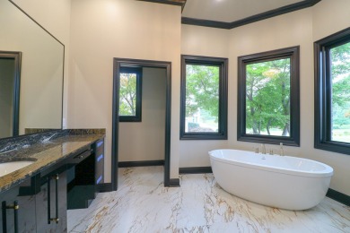 This stunning all-brick home, has been completely remodeled to on RidgePointe Country Club in Arkansas - for sale on GolfHomes.com, golf home, golf lot