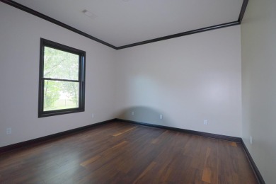 This stunning all-brick home, has been completely remodeled to on RidgePointe Country Club in Arkansas - for sale on GolfHomes.com, golf home, golf lot
