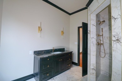 This stunning all-brick home, has been completely remodeled to on RidgePointe Country Club in Arkansas - for sale on GolfHomes.com, golf home, golf lot