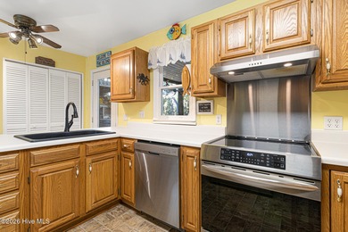 Canalfront 4-bedroom home situated on a private lot in Pine on The Country Club of the Crystal Coast in North Carolina - for sale on GolfHomes.com, golf home, golf lot