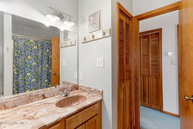 Canalfront 4-bedroom home situated on a private lot in Pine on The Country Club of the Crystal Coast in North Carolina - for sale on GolfHomes.com, golf home, golf lot