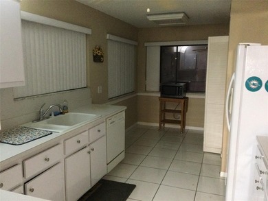 BEAUTIFUL SPACIOUS FIRST FLOOR GARDENS UNIT WITH FABULOUS VIEW on Pine Island Ridge Country Club in Florida - for sale on GolfHomes.com, golf home, golf lot