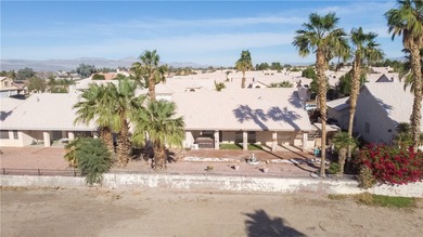 Come see this 3-bedroom, 2-bath home located right on the golf on Desert Lakes Golf Course in Arizona - for sale on GolfHomes.com, golf home, golf lot