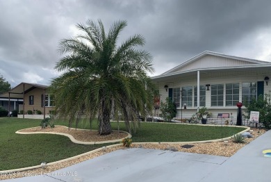 HOT TUB on large rear patio on the GOLF COURSE Located on a on High Point Golf Club, Inc. in Florida - for sale on GolfHomes.com, golf home, golf lot