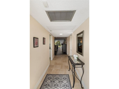 Beautiful, spacious residence with large, screened patio on Palm-Aire Country Club and Resort - Palms in Florida - for sale on GolfHomes.com, golf home, golf lot